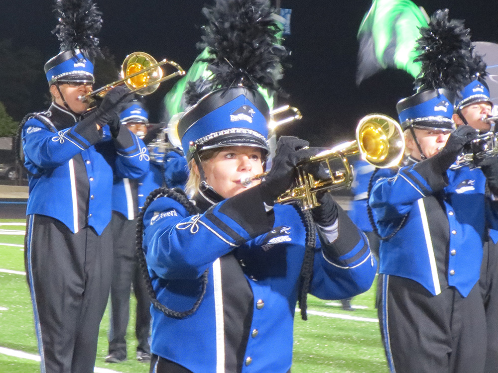 Close-up photo of the UK logo on a drum major's jacket.