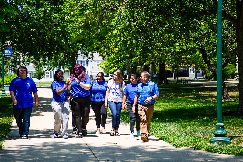 President Gatrell walking with students