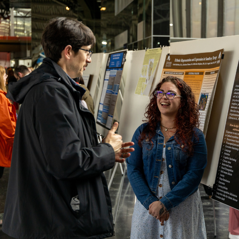 EIU faculty member talking to prospective student