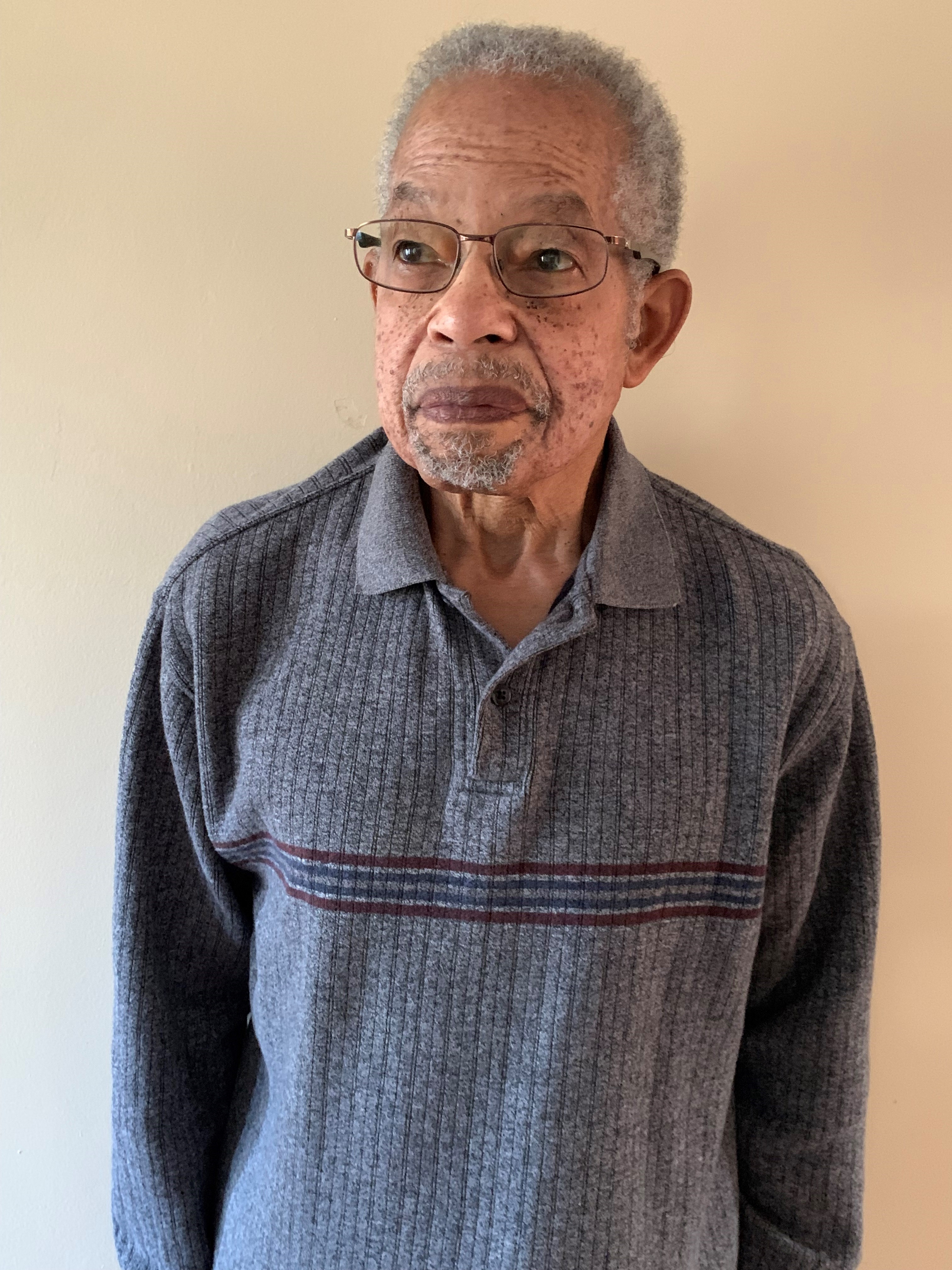 Man with glasses and blue shirt