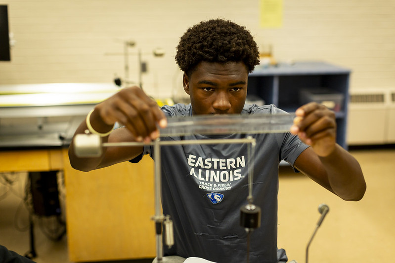student in physics lab