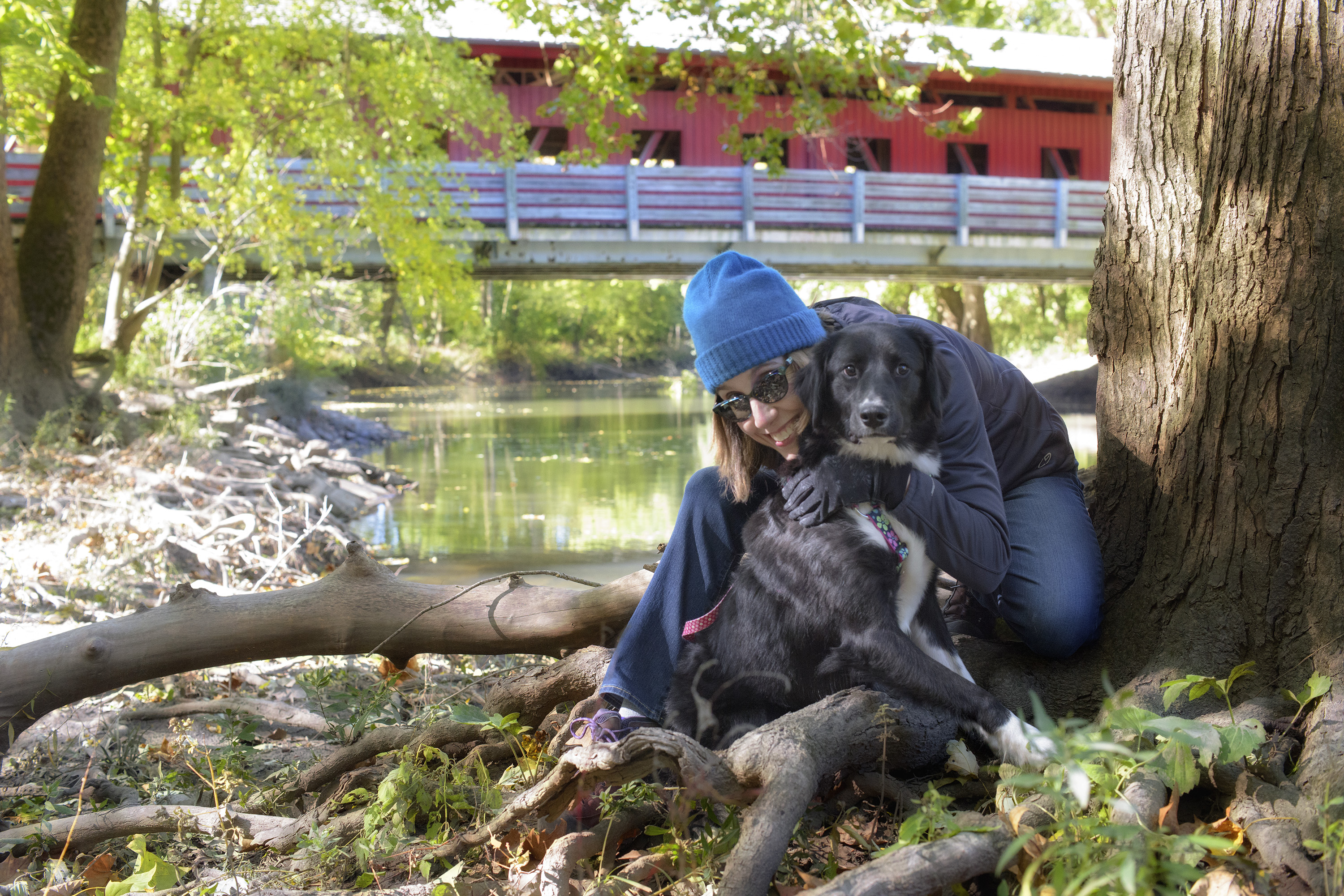 Woman outside in fall with dog