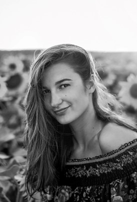 Black and white outdoor photo young woman