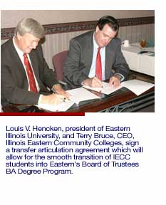 Louis V. Hencken and Terry Bruce sign agreement