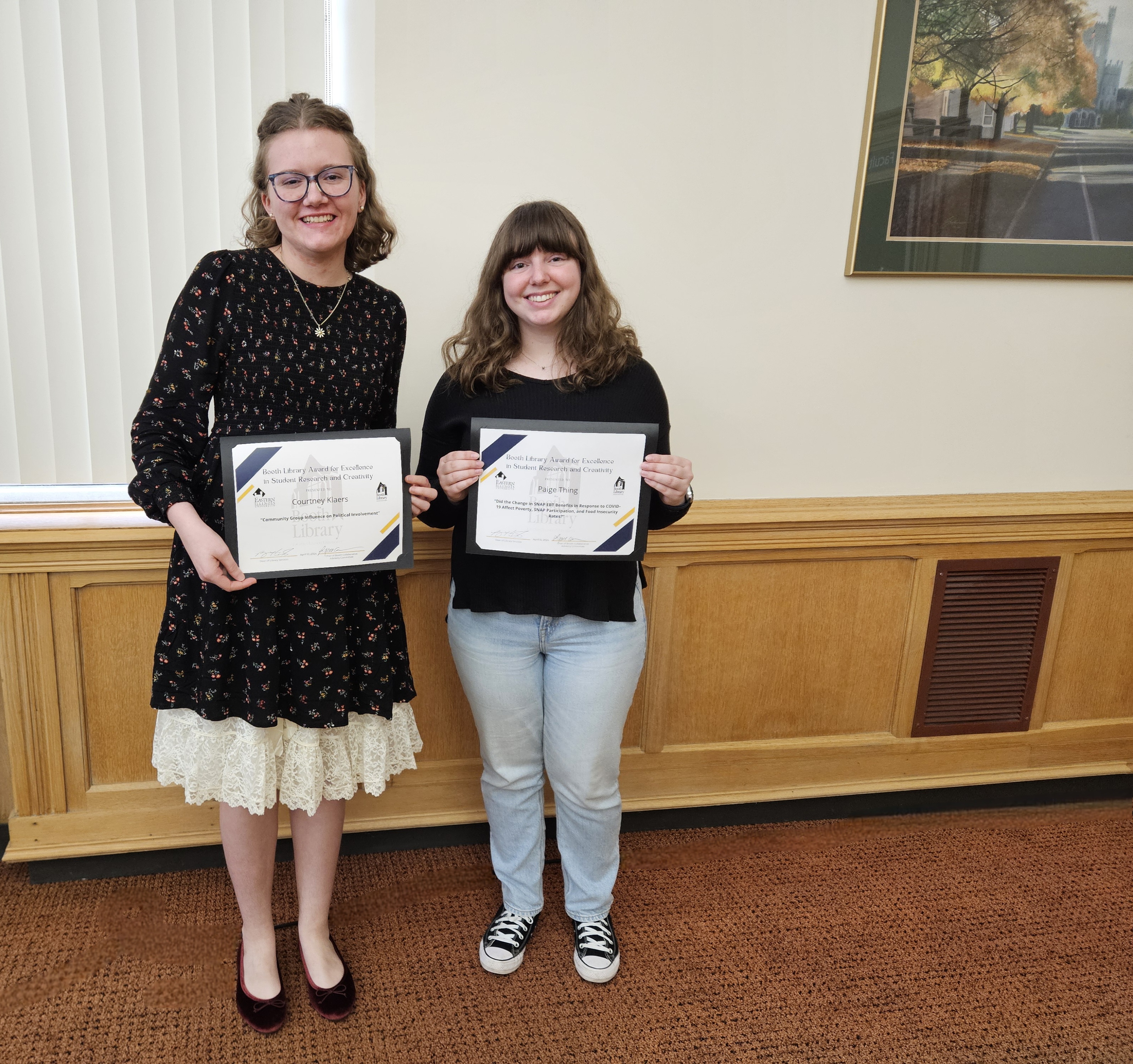 Junior Courtney Klaers and senior Paige Thing received awards from Booth Library for their research projects.