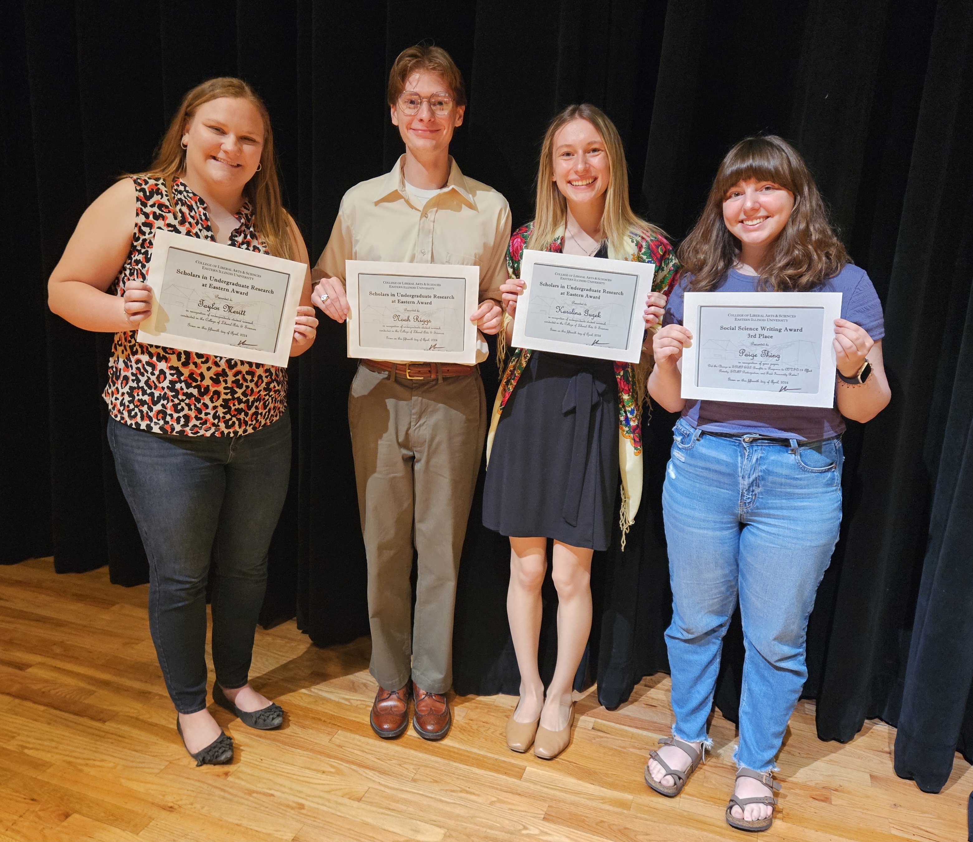Seniors Taylor Meritt, Noah Riggs, and Karolina Guzek won Scholars in Undergraduate Research Awards for their senior capstone, while senior Paige Thing received Social Science Writing Award recognition for her senior capstone.