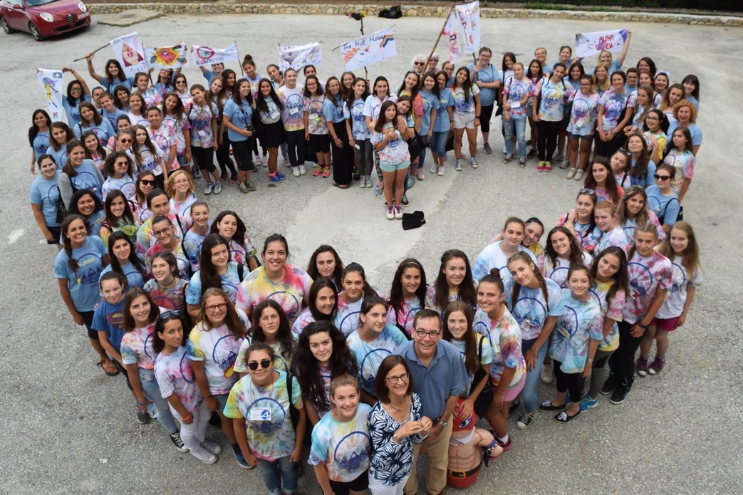 group of people forming a heart